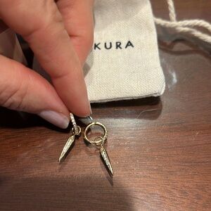 Waekura mini creole earrings with charms from Le Bon Marché in Paris.